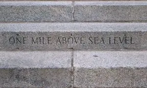 Image of a stone carving in Denver that shows the elevation of one mile above sea level