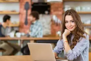 Image of a woman writing an eBook for her home-based business
