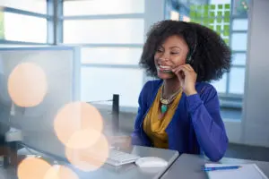 Female receptionist providing call forwarding answering services