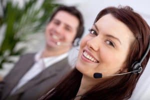 Image of two call center agents providing answering service in Alabama