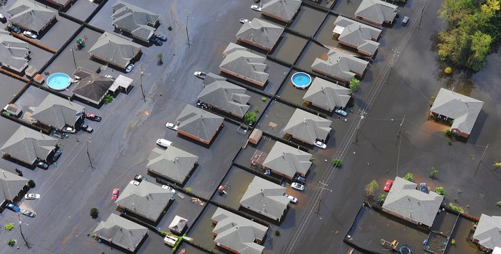 Image of flooded houses prepared to get in contact with an emergency restoration answering service