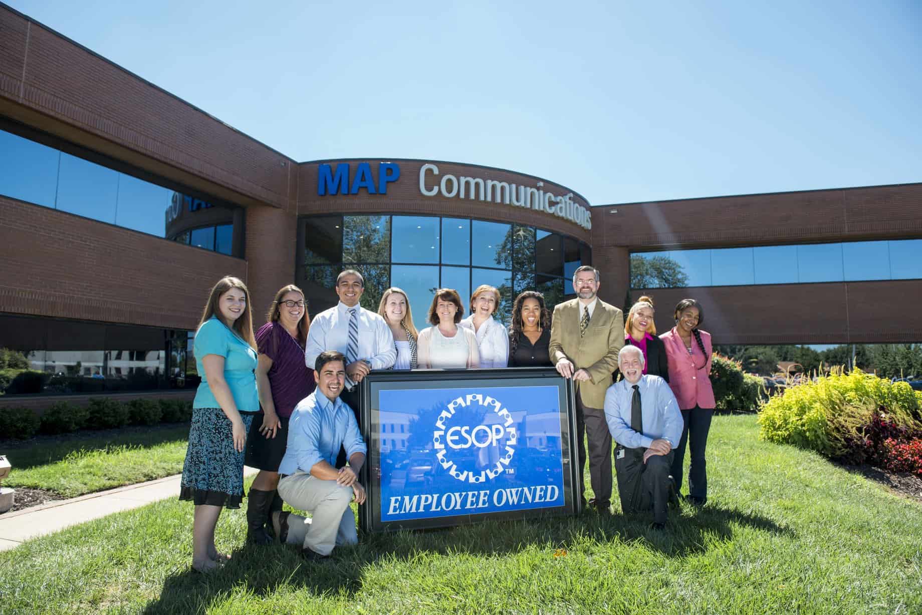 Image Of Map Communications Team Members Holding A Sign That Says We Are Anemployee Owned. Who We Are Map Communications image of map communications team members holding a sign that says we are anemployee owned. who we are map communications