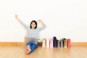 Image of a woman selling goods online for her home-based business