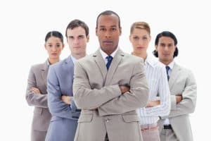 Image of a team of business professionals who rely on a whistleblower hotline to report improper behavior