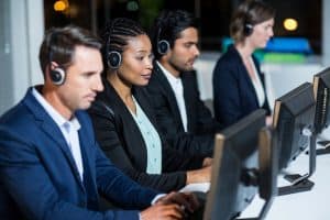 Image of four MAP Communications agents providing whistleblower hotline service