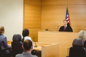 Image of a courtroom with lawyers that use a legal answering service