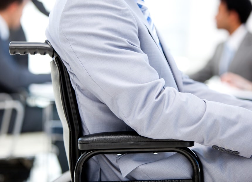 Image of a man in a wheelchair who is speaking with a lawyer who uses an answering service for personal injury attorneys