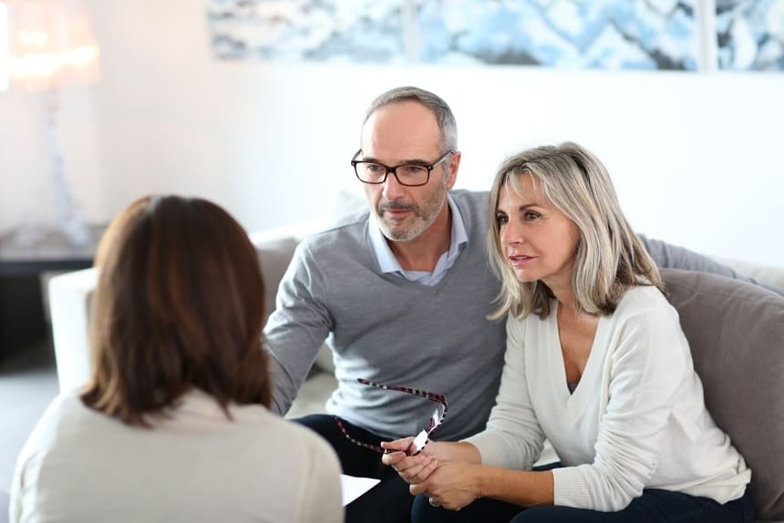 Image of a couple speaking with an attorney that uses an estate, trust, and elder law answering service