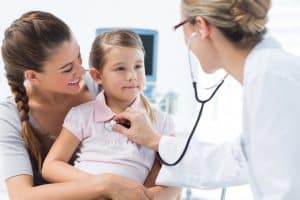 Image of a mother, child, and pediatrician