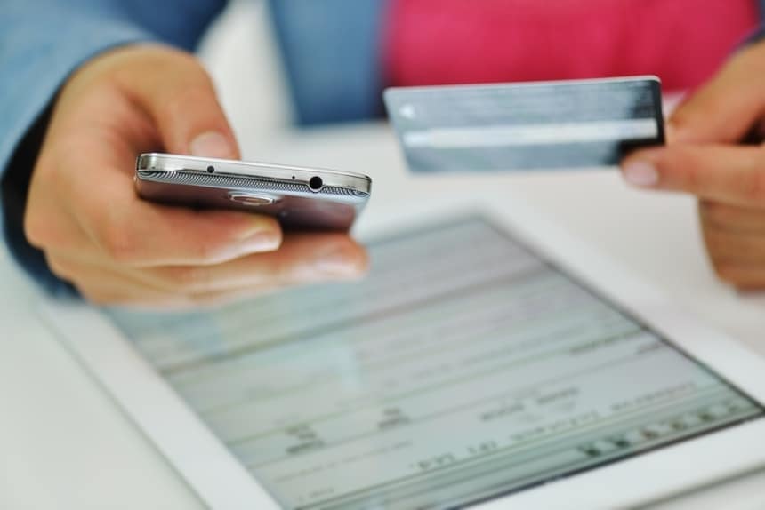 Image of a person with a credit card calling a call center for banks and lenders