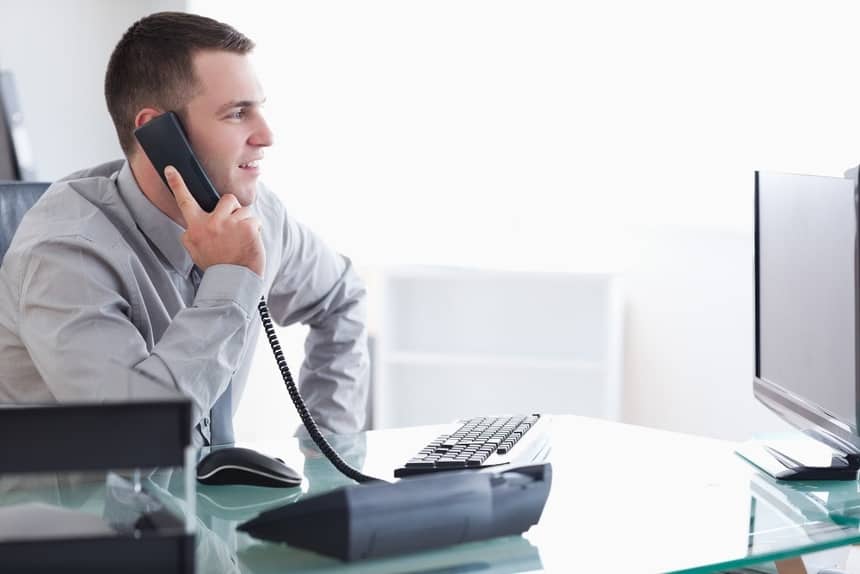 Image of a businessman receiving a transferred call from his virtual receptionist