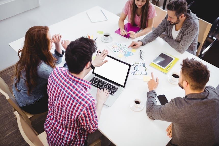 Image of a marketing team that uses an answering service for media companies