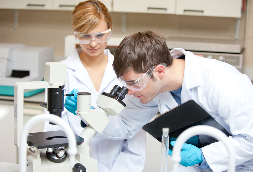 Answering Service for Clinical Labs Image of two people working in a clinical laboratory