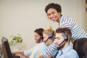 four call center employees providing answering services for non-profits