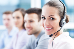 four call center agents working in an outsourced customer service department