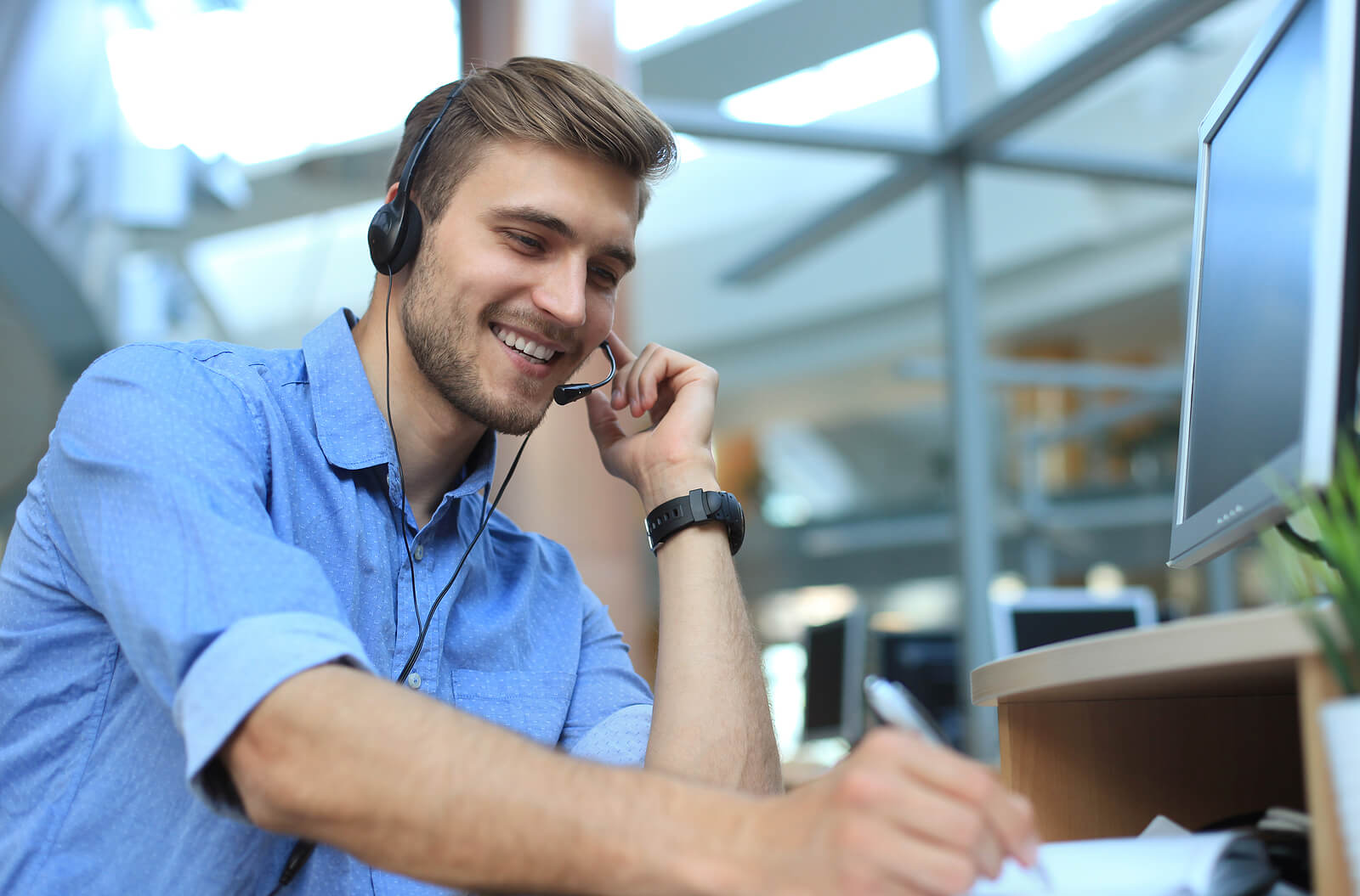 Man Greeting Customers on the Phone