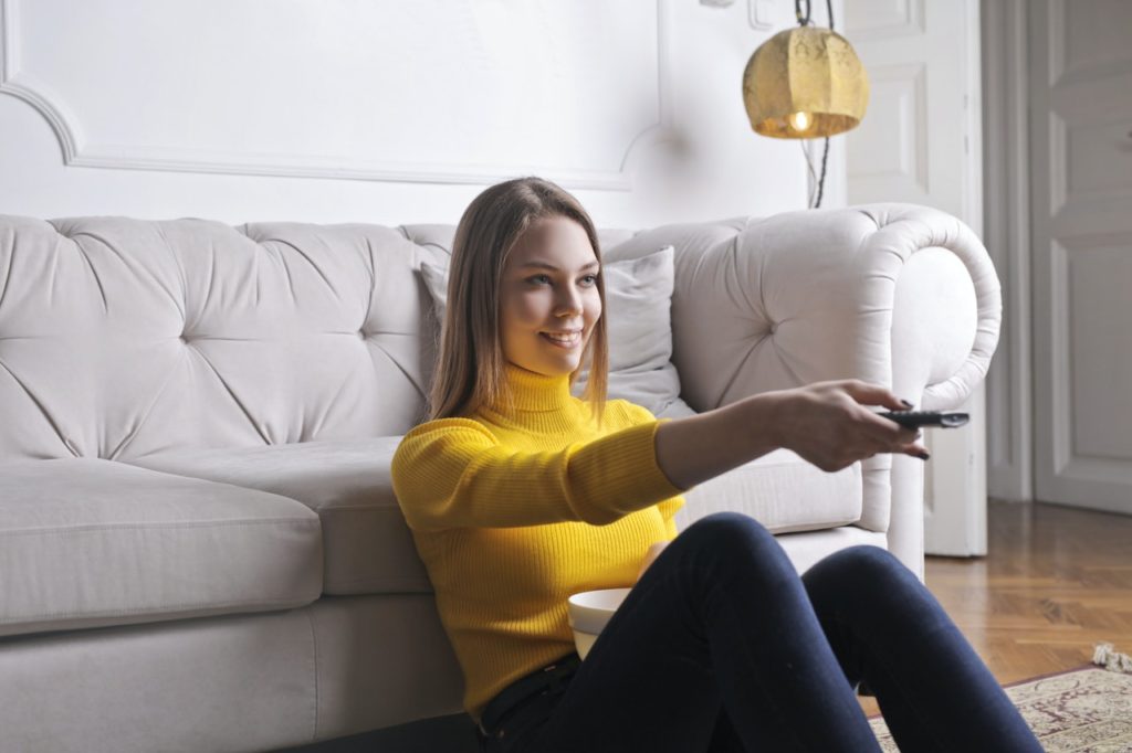 woman watching customer service quotes on tv