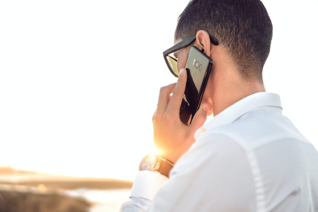 man on the phone handling a call