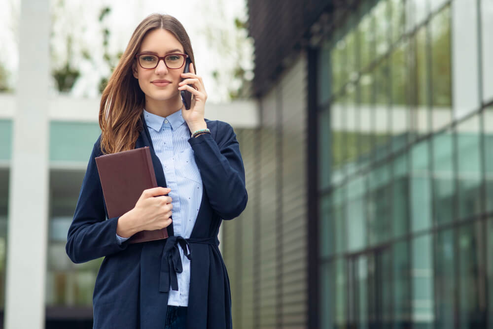 Real Estate Agent Talking on the Phone with a Client