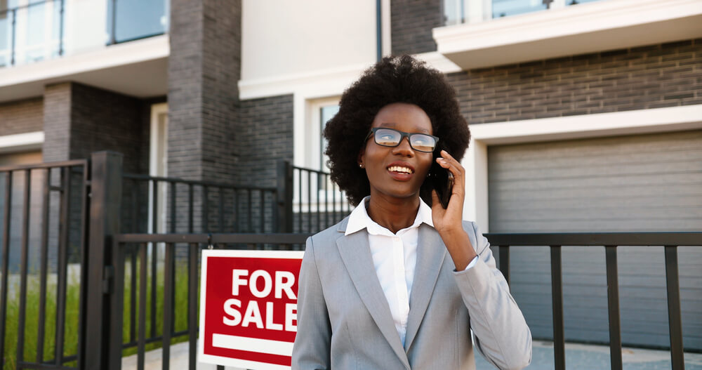 Real Estate Agent Talking on the Phone with a Client