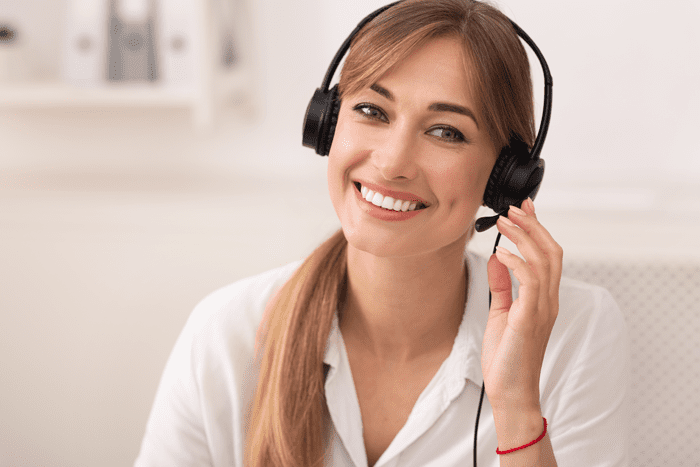 MAP Communications live answering service agent with headset