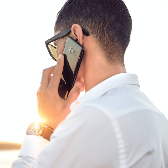 man on the phone handling a call