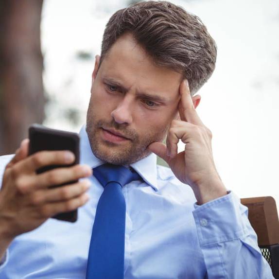 Image of a professional getting a message from his emergency dispatch service