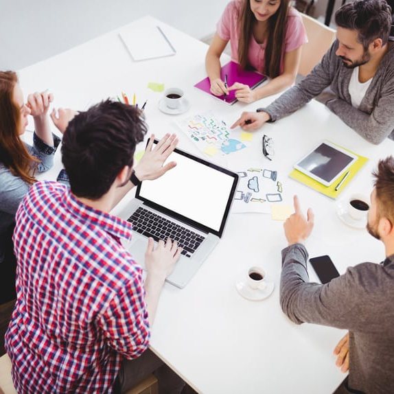 Image of a marketing team that uses an answering service for media companies