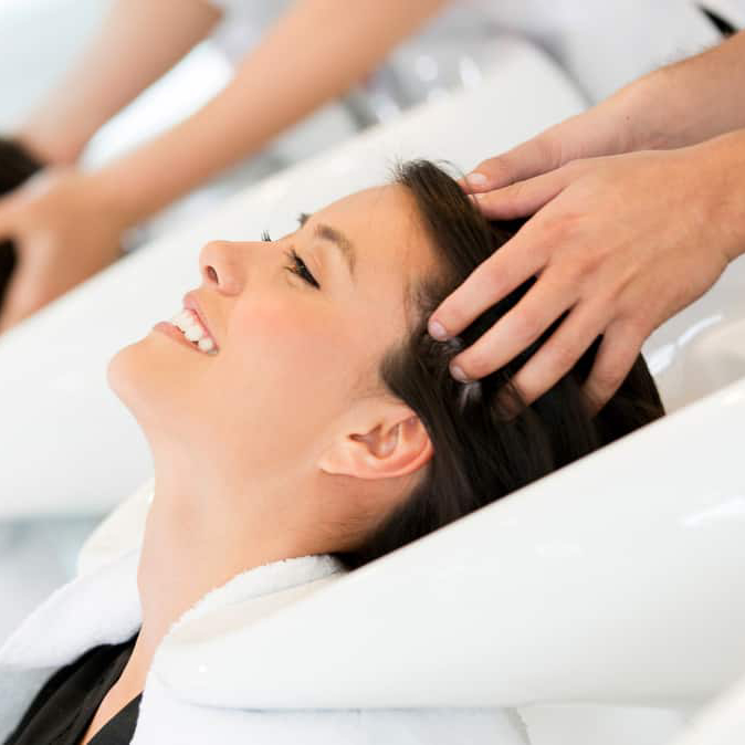 image of two women getting their hair washed in a salon