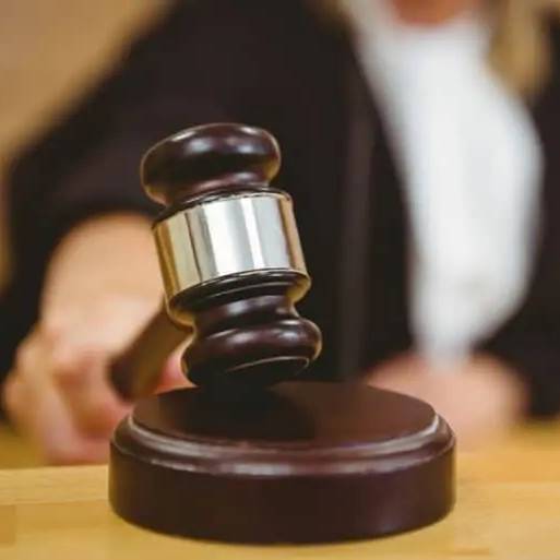 Image of a gavel in a courtroom