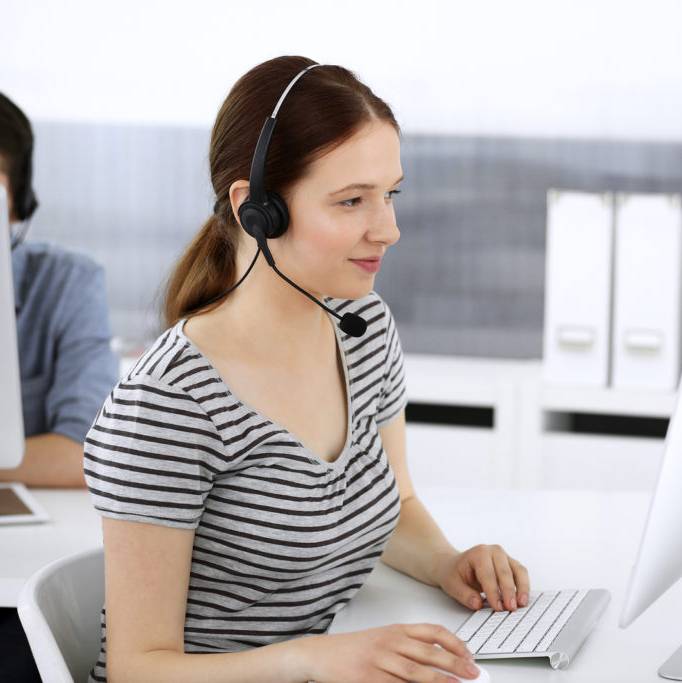 image of a receptionist working for the Map Communications funeral call center team