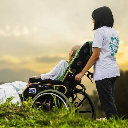 a home health professional providing hospice service to an elderly person