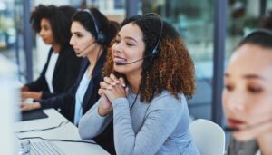 three receptionists with headsets on calls